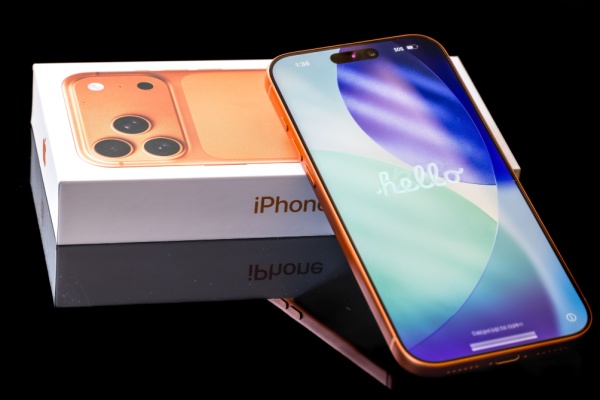 Box and iPhone 17 Pro Max smartphone in orange