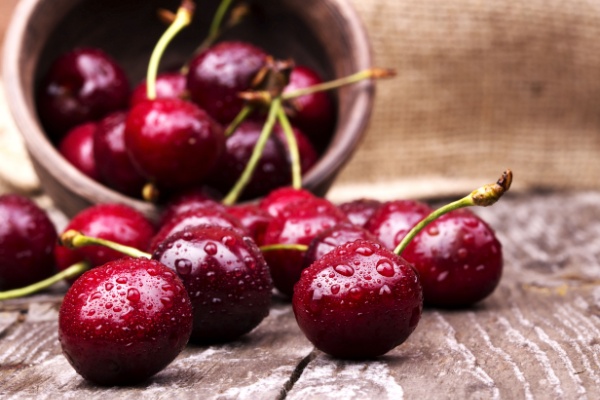 Freshly washed cherries on a wooden table
