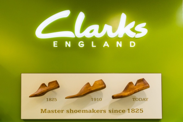 Clarks of England illuminated sign and shoe evolution from 1825 to present