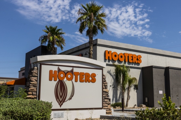 Exterior Hooters restaurant with name and owl logo
