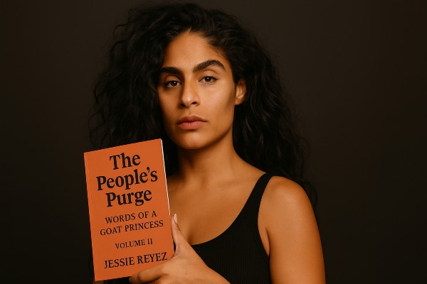 Jessie Reyez holding her book