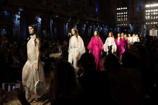 Models walk runway at Milan Fashion Week