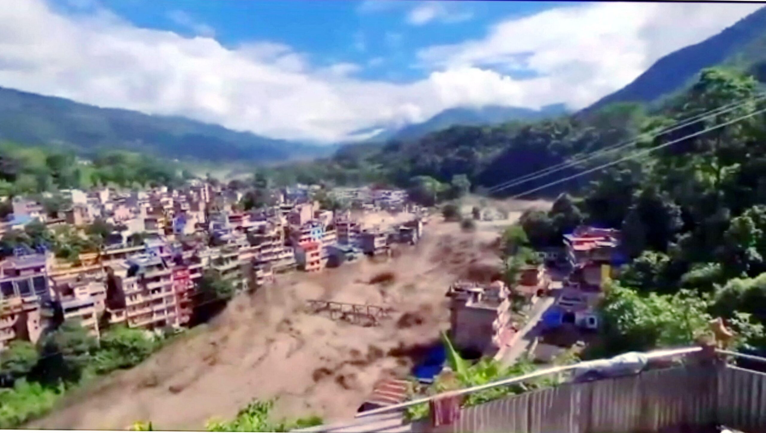 Nepal Flooding disaster, muddy water crashing through village