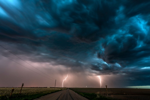 Clouds and lightning over midwest plains landscape at night