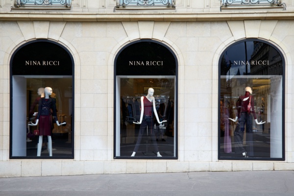 Nina Ricci storefront with mannequins posed in 3 windows, Paris