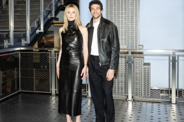 Sarah Pidgeon and Paul Anthony Kelly of Love Story pose in front of Empire State Building New York City