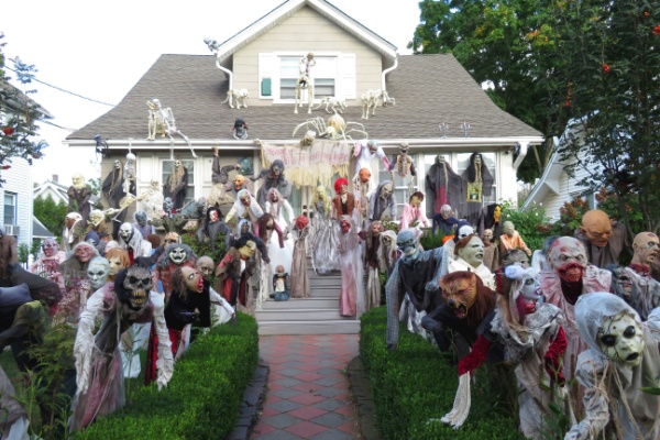 quaint house front yard filled with zombies and ghouls