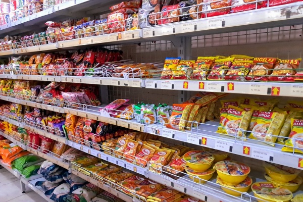 grocery store shelves filled with ultra-processed packaged foods